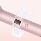 Fer à lisser rose avec écran LED affichant 210°C et bouton d'allumage, réglages de température